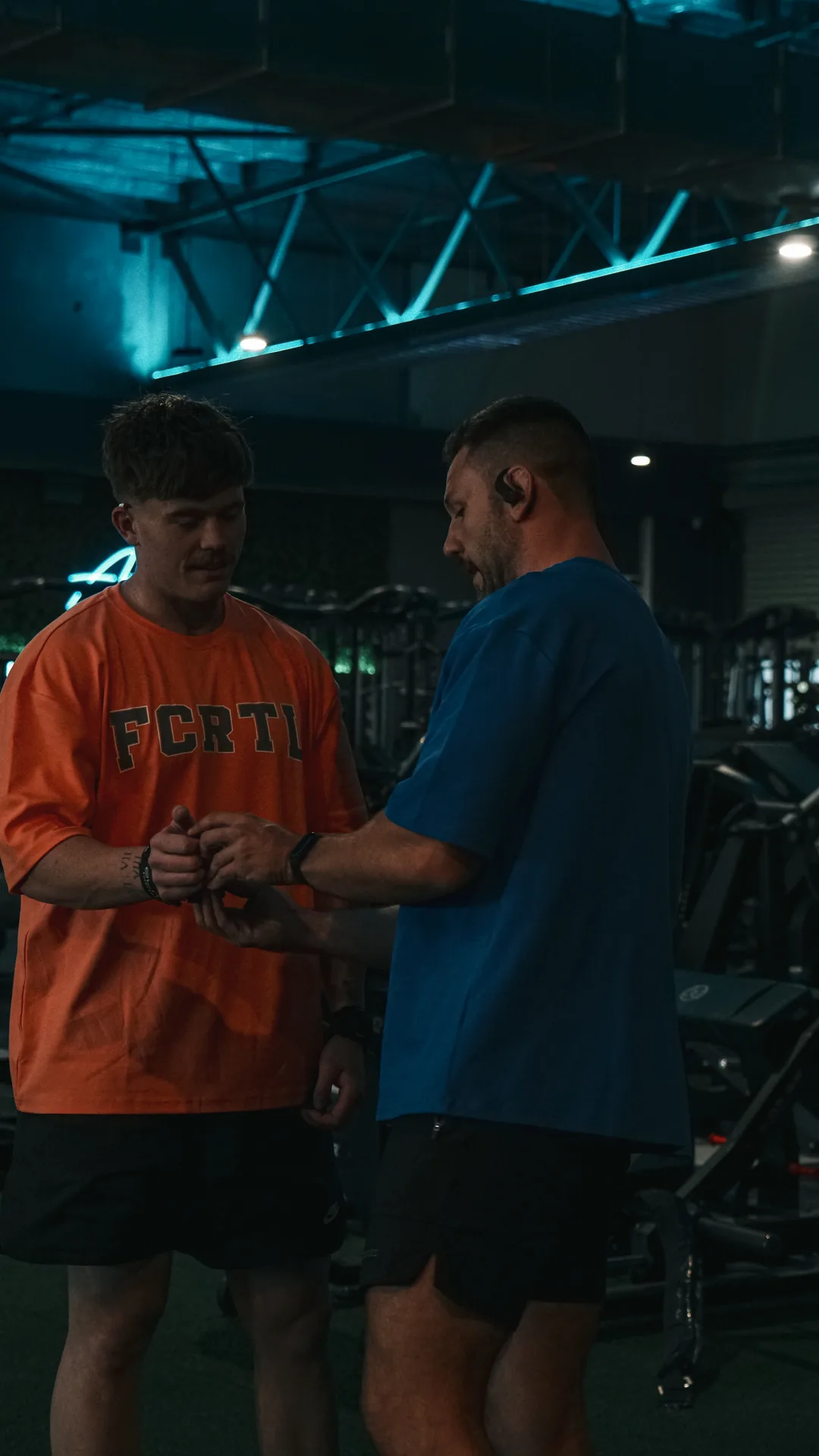 Michael coaching a client in the gym